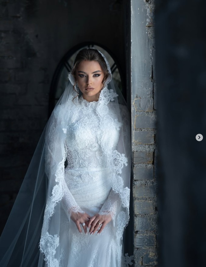 Handmade bridal gown with lace veil